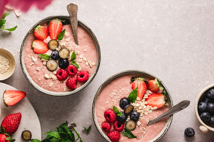 Delicious fruit smoothies on kitchen counter